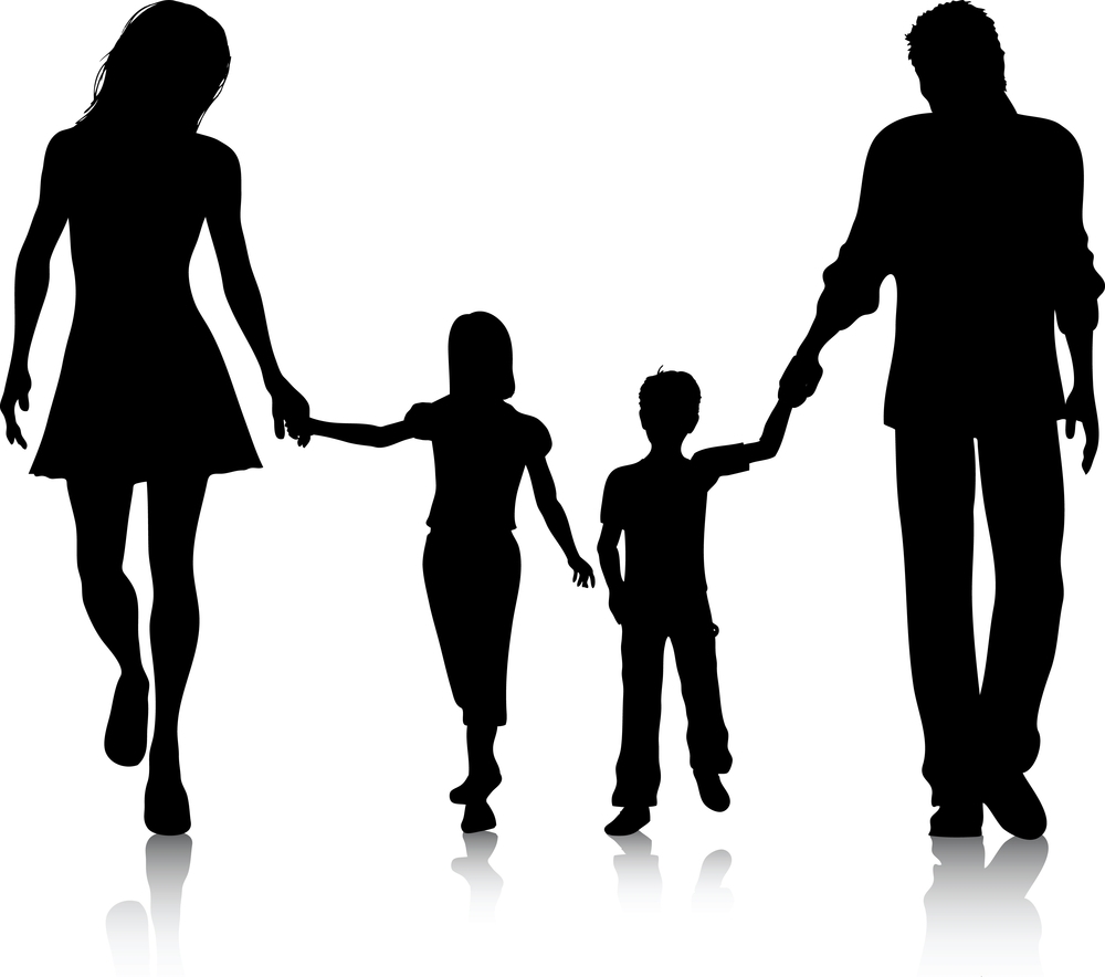 Silhouette of a family of four walking hand-in-hand, reflecting unity and togetherness.