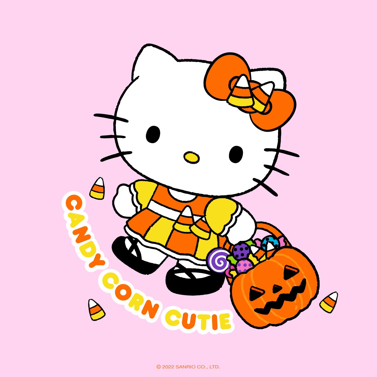 Hello Kitty in candy corn costume holding a jack-o'-lantern basket full of Halloween treats on pink background.