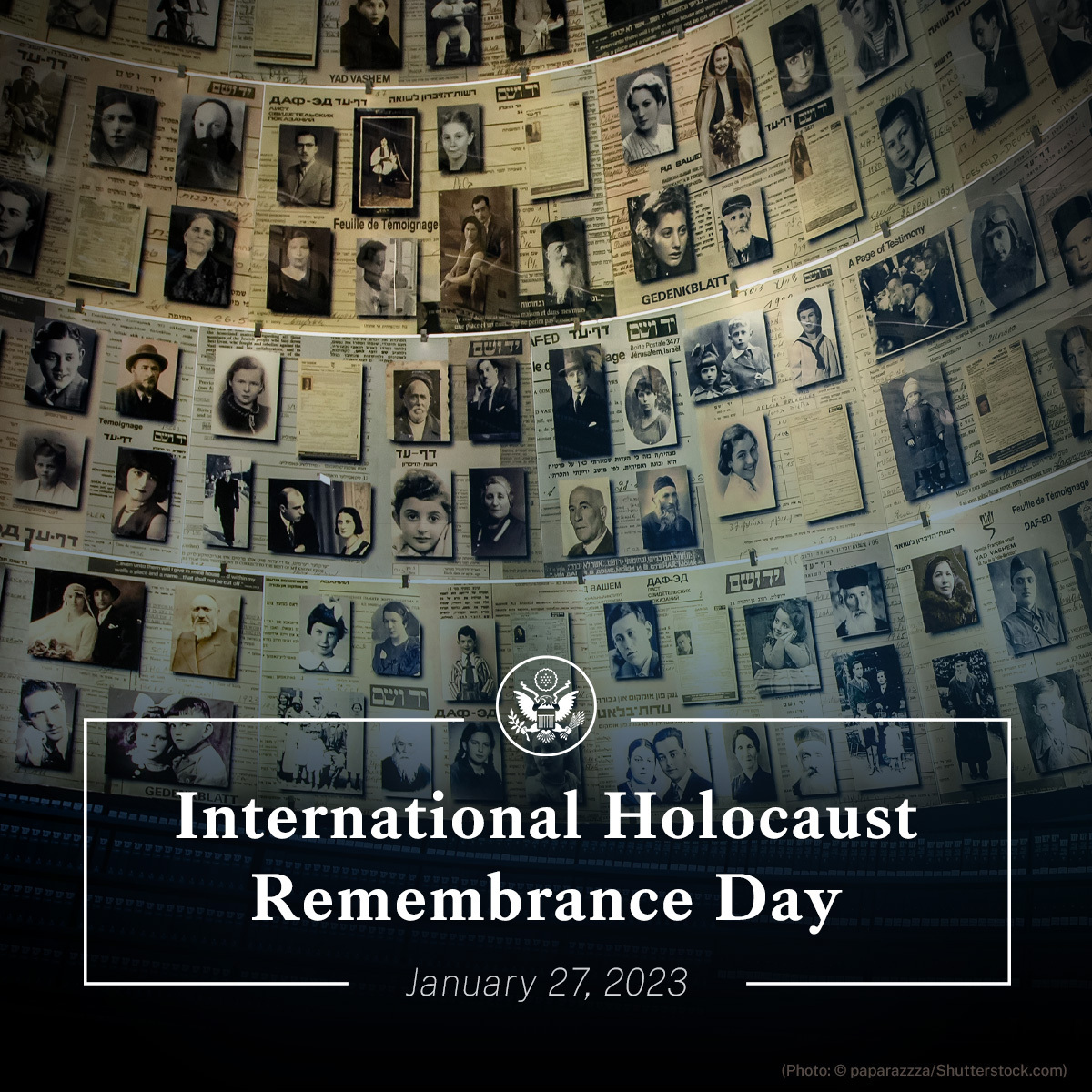 A wall covered with Holocaust-era photographs, documents, and testimonies, commemorating International Holocaust Remembrance Day.