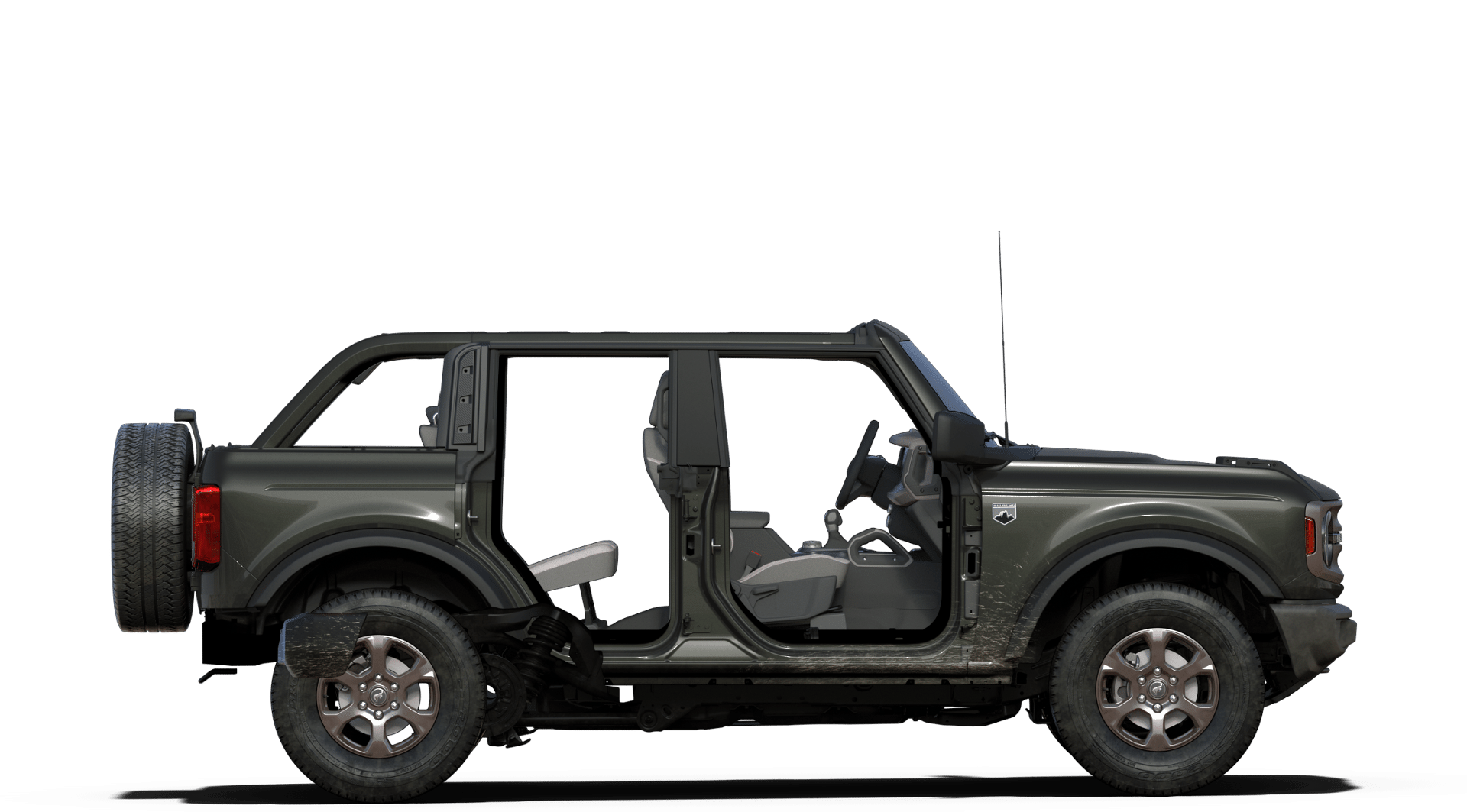 Gray Ford Bronco 2-door with doors and roof removed, showcasing rugged off-road design and interior layout.