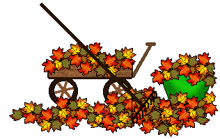 Wooden wagon and green bucket overflowing with colorful autumn leaves, with a rake resting across the wagon.