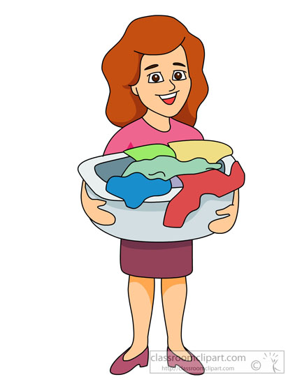 Smiling woman with red hair holding a laundry basket full of colorful clothes.