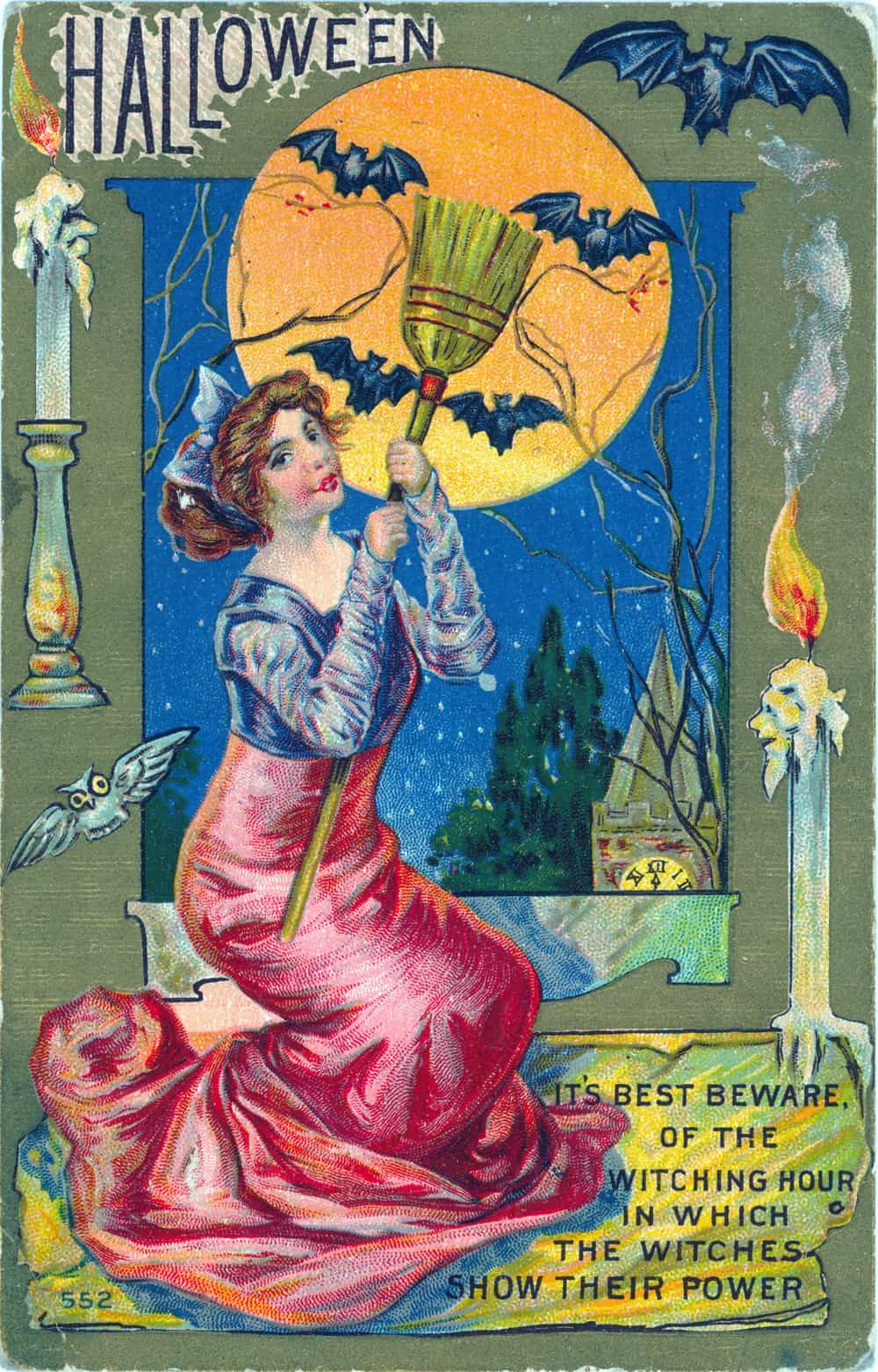 Vintage Halloween postcard featuring a witch in red gown holding a broom under a full moon with bats, candles, and an owl.