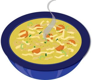 A steaming bowl of creamy noodle soup with carrots, green onions, and shredded cheese.