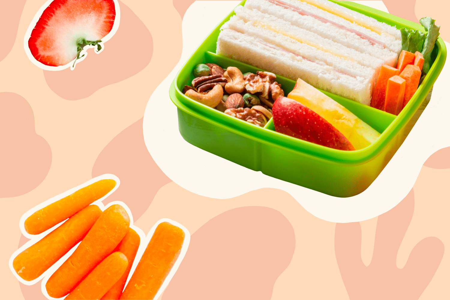 Green bento box with triangular sandwiches, mixed nuts, apple slices, carrot sticks, and lettuce; strawberry slice and carrots float nearby.