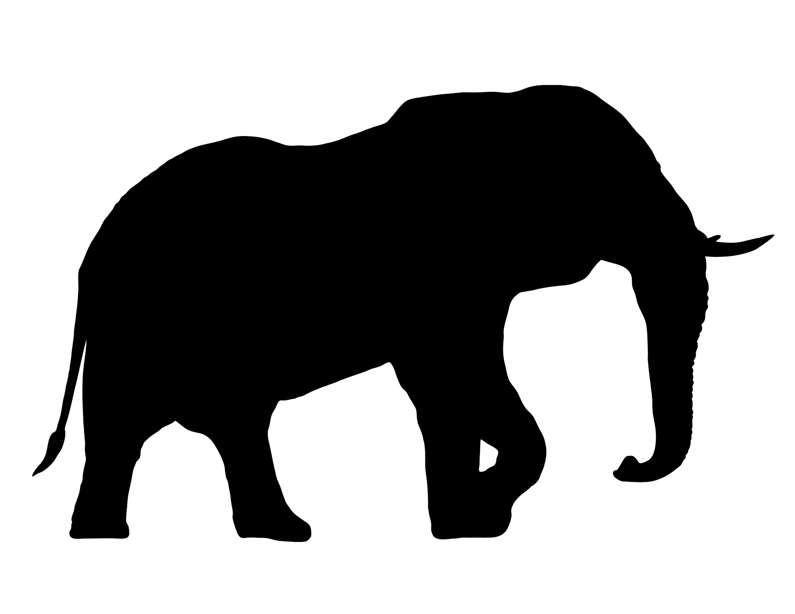 Black silhouette of an elephant in profile, trunk lowered, walking left to right on white background.