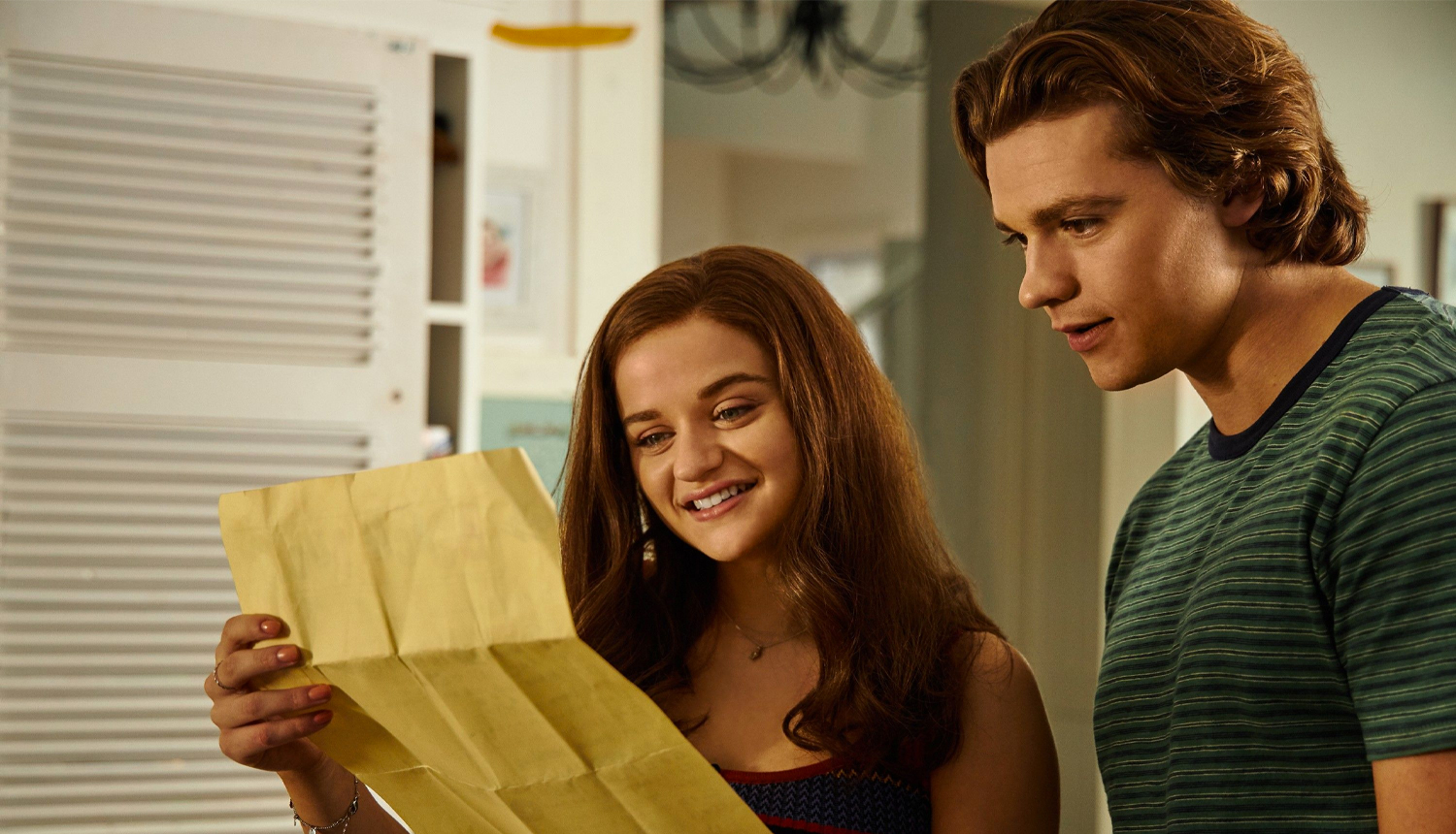 Teen Romance Scene with Envelope - Emotional Moment Captured