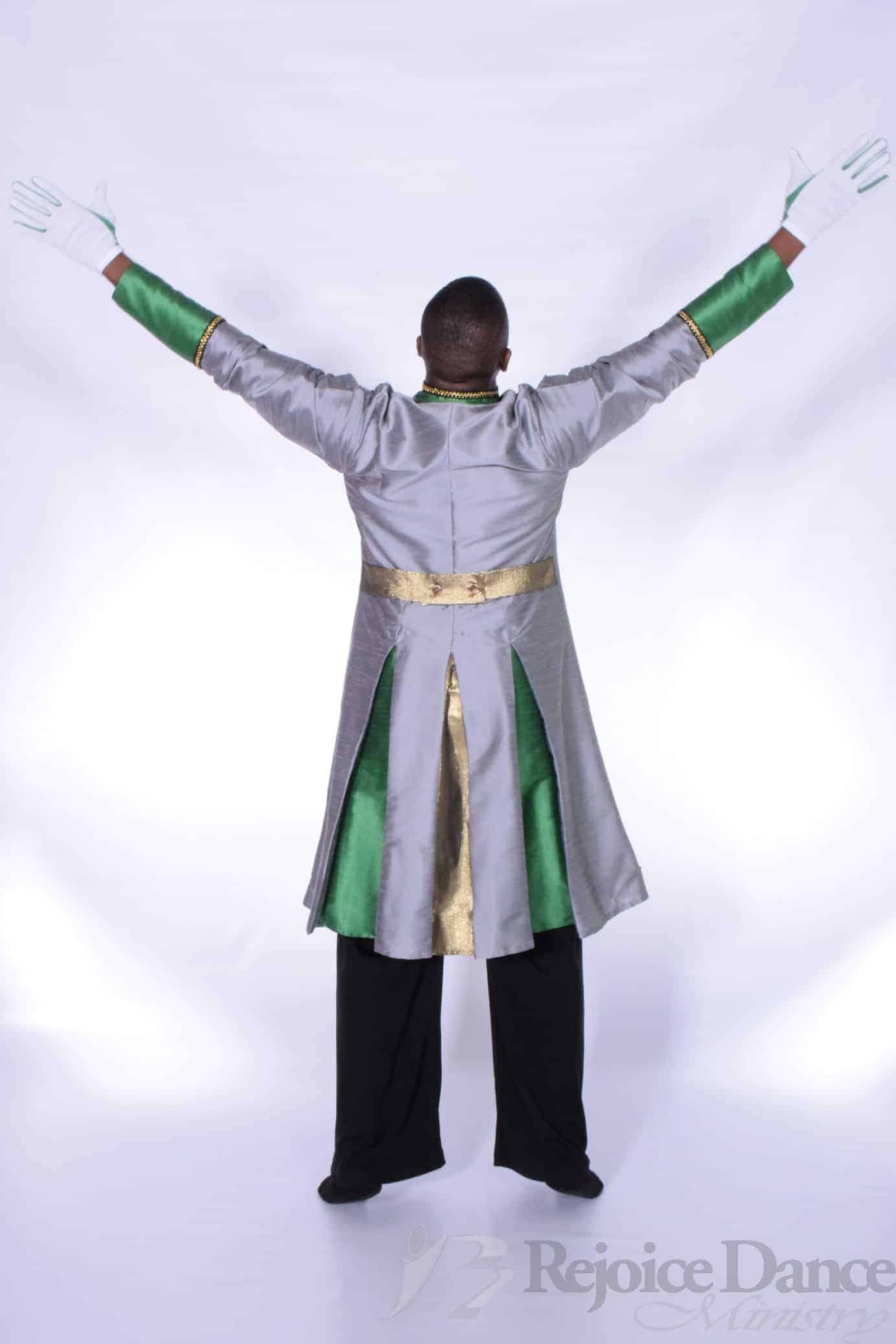 Back view of a dancer in silver-green liturgical robe with gold trim, arms raised in worship pose.