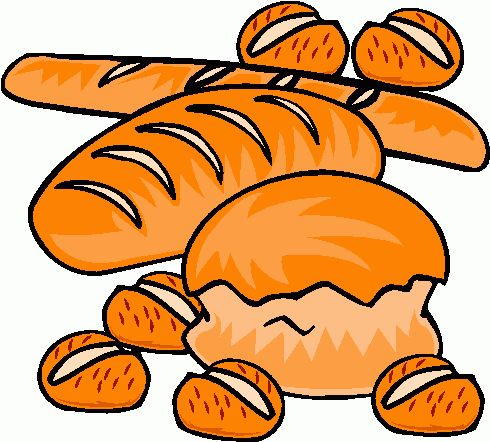 Assorted fresh baked breads including baguettes, rolls, and a round loaf with scored crust.