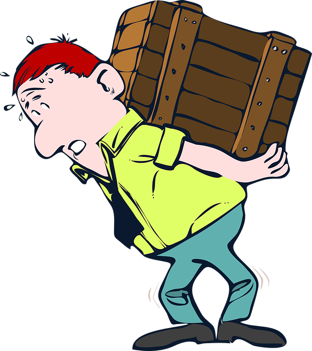Cartoon man with red hair straining under heavy wooden crate, sweating and bent over in effort.