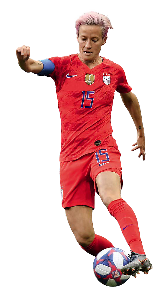 Megan Rapinoe in red USA jersey, number 15, dribbling a soccer ball with pink hair and focused expression.