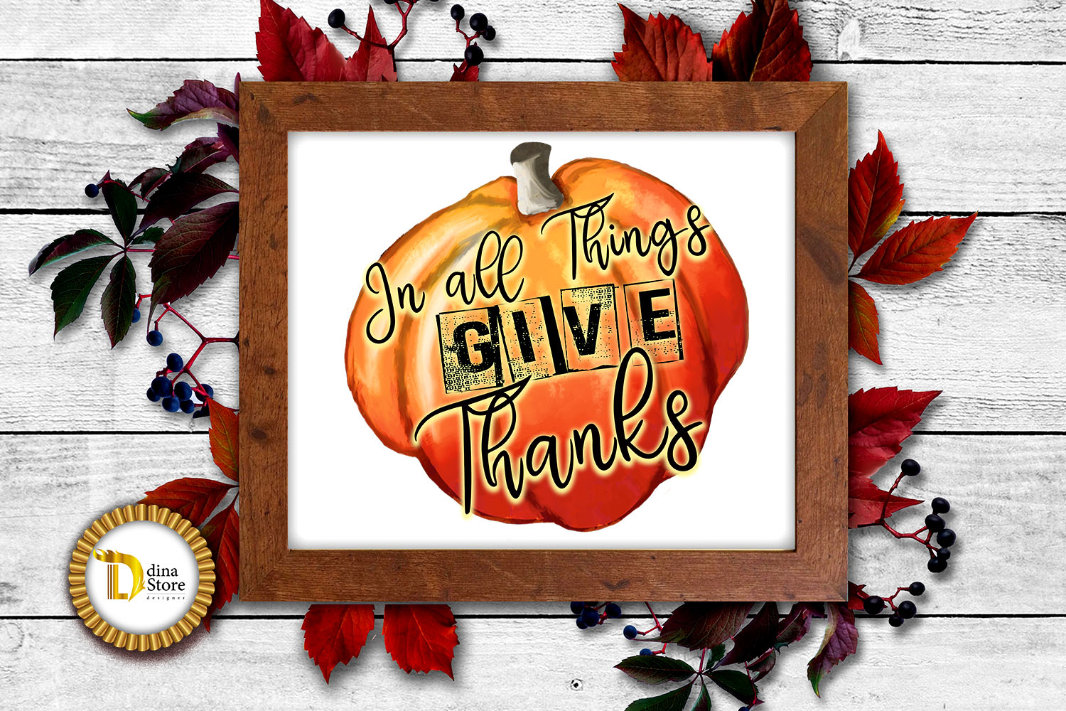Framed autumn pumpkin art with "In all Things Give Thanks" text, surrounded by red leaves and berries on white wood background.