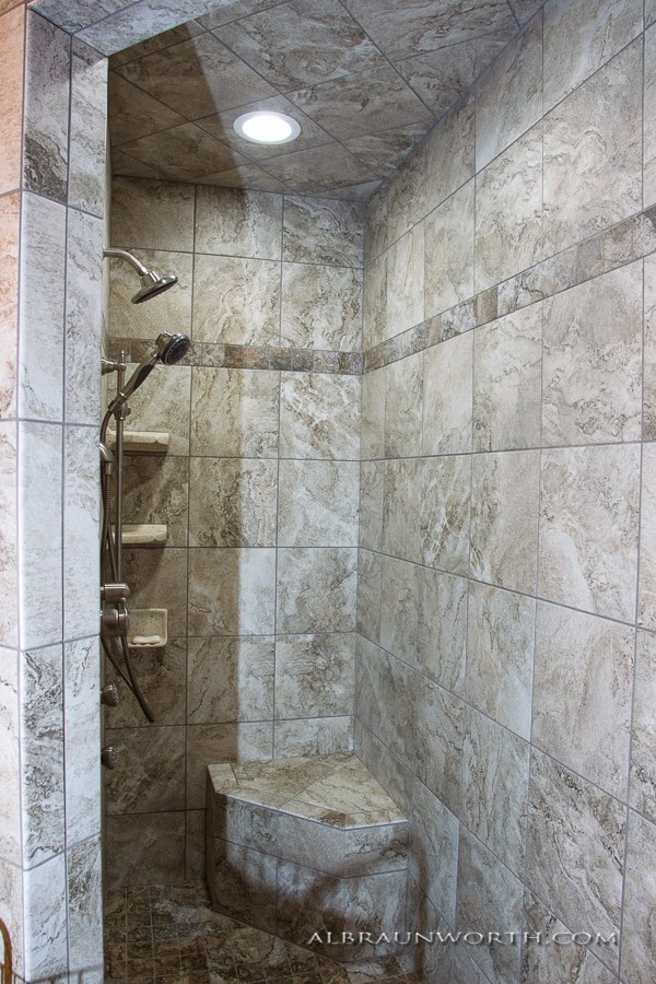 Luxury Marble Shower Design with Built-In Bench and Dual Showerheads