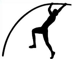 Silhouette of an athlete performing a pole vault, mid-air over the bar with bent pole.