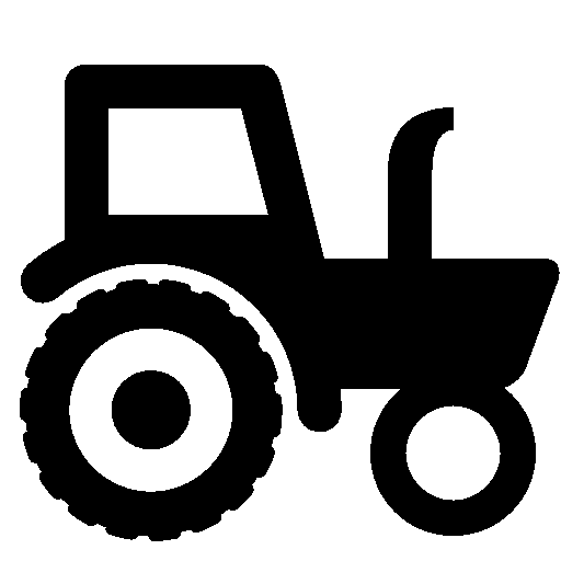 Black silhouette of a farm tractor on green background, showing large rear wheel, cabin, and exhaust pipe.