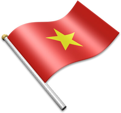 Vietnamese national flag waving on a flagpole, red field with a central yellow five-pointed star.