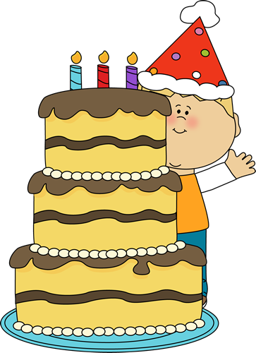 A smiling child in a party hat beside a three-tiered birthday cake with lit candles and chocolate frosting.
