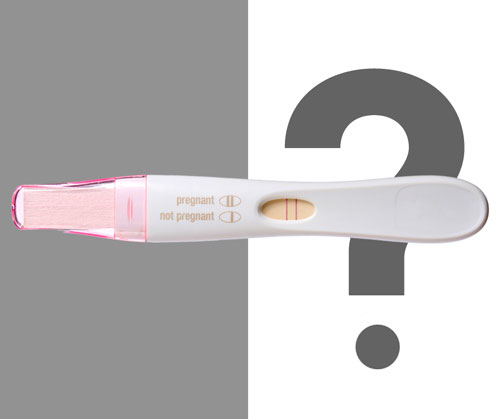 A pregnancy test showing two lines indicating a positive result, with labeled "pregnant" and "not pregnant" indicators.