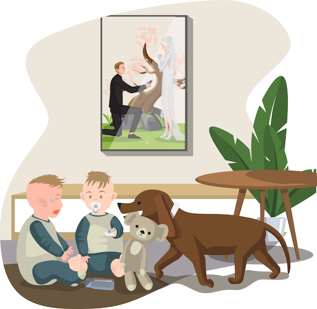 Two toddlers sit on the floor with a dog and teddy bear, beneath a framed wedding photo on the wall.