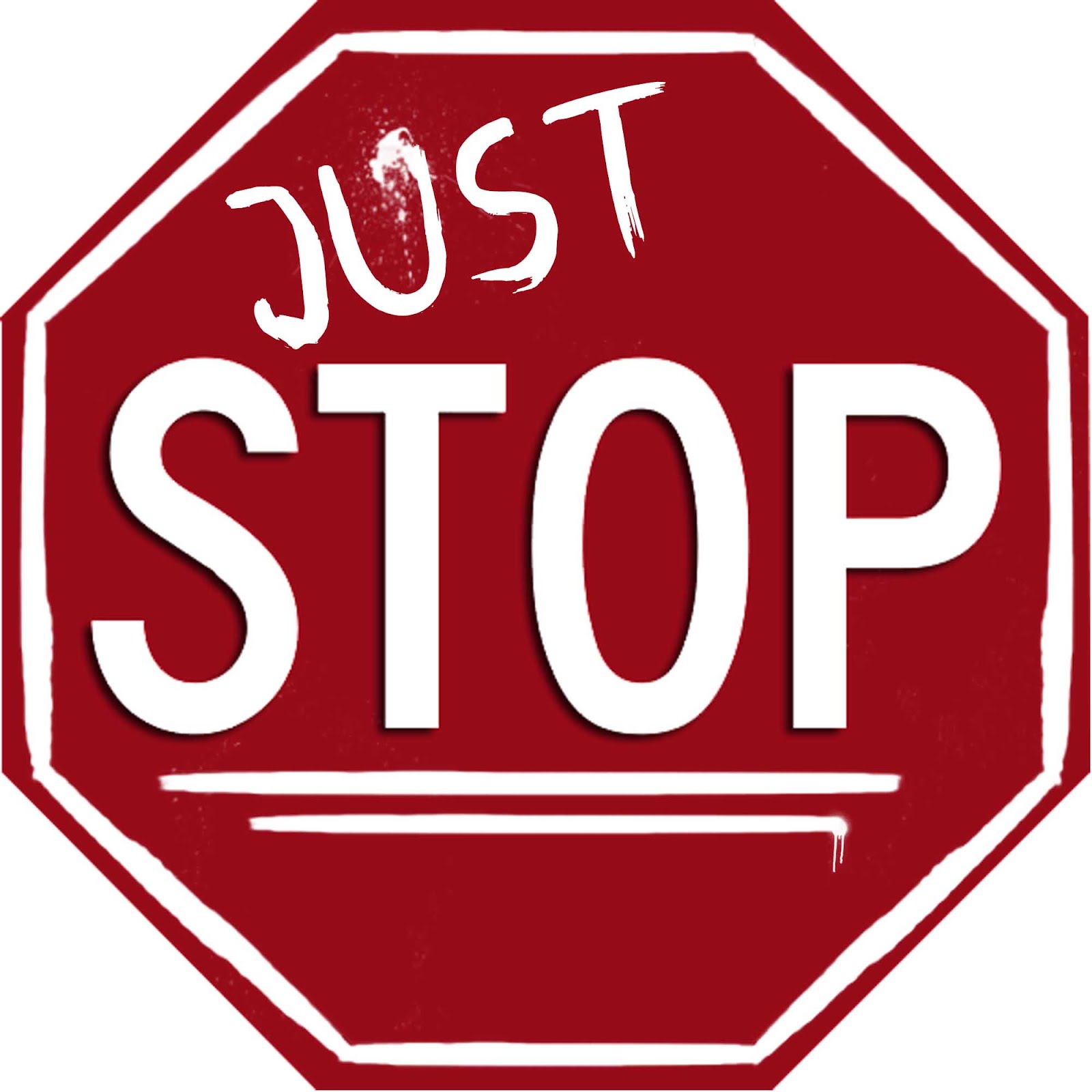 Modified red octagonal stop sign with "JUST STOP" in white graffiti-style text, emphasizing urgency or protest.