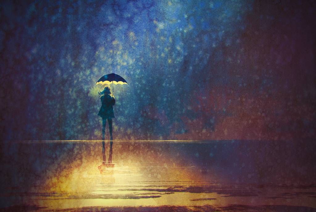 Solitary Figure with Umbrella in Dreamy Rainy Night Scene