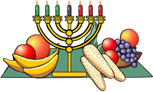 A golden menorah with seven colored candles stands beside a bowl of fruit, grapes, corn, and bananas on a green cloth.
