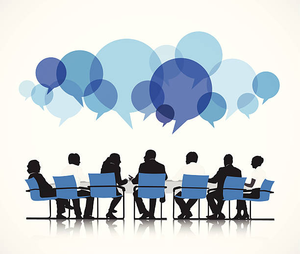 Silhouetted group in meeting with speech bubbles above, symbolizing collaboration and discussion.