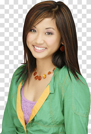 Young East Asian woman smiling, wearing green jacket, purple top, amber necklace, and red earrings against transparent background.