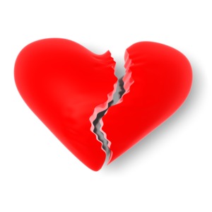 A glossy red heart split vertically down the middle with a jagged crack, symbolizing emotional pain or heartbreak.