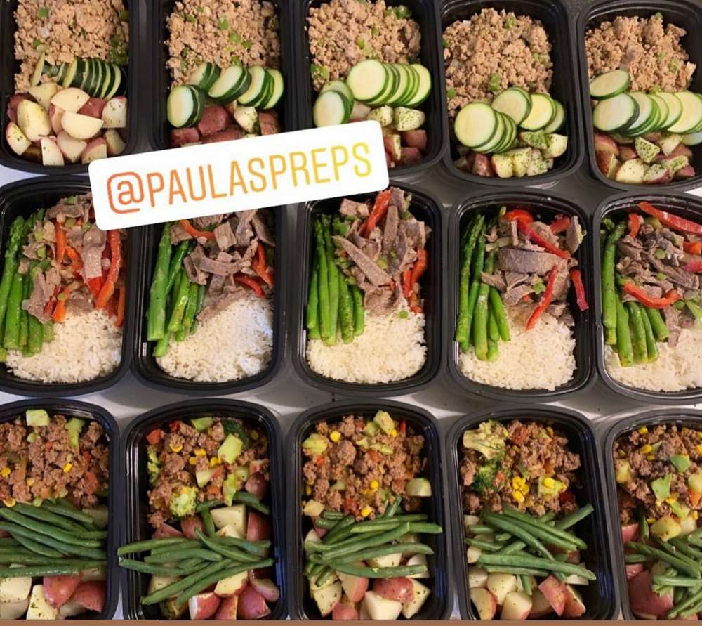 Pre-portioned healthy meal prep containers with lean protein, rice, and colorful vegetables; @PAULASPREPS branding overlay.