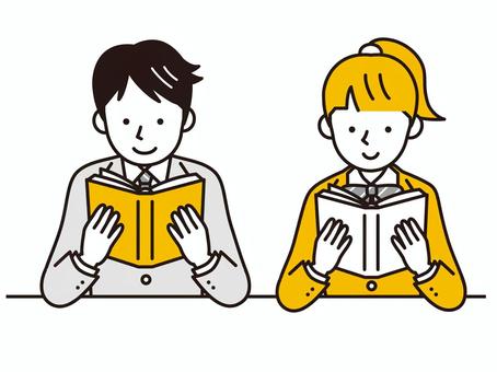 Two students, a boy and a girl, sitting side by side reading open books with focused, smiling expressions.