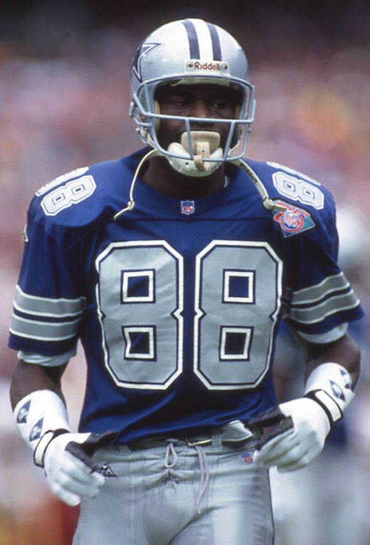 Dallas Cowboys wide receiver wearing #88 jersey and Riddell helmet during a game in the late 1980s or early 1990s.