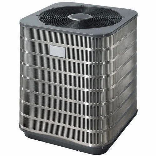 Outdoor central air conditioning condenser unit with fan and aluminum fins.