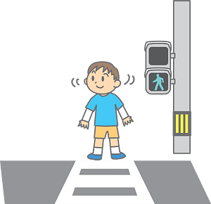 A smiling child in a blue shirt and yellow shorts stands at a crosswalk with a green walk signal illuminated.