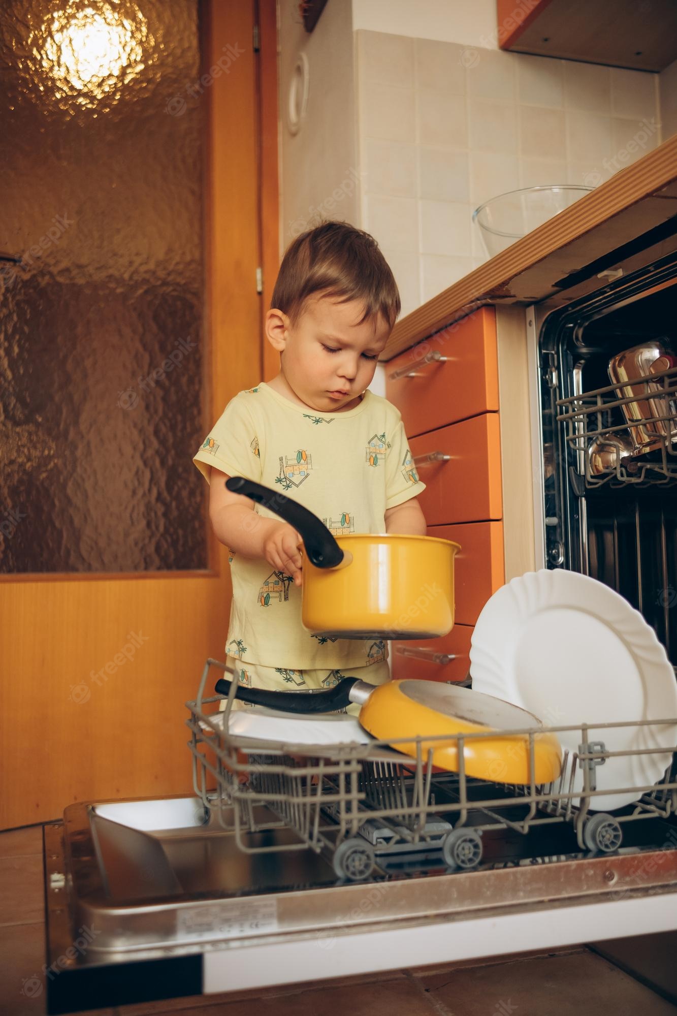 Premium Vector | Boy putting dirty dishes in the dishwasher the - Clip ...