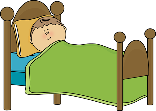 A smiling child sleeping peacefully in a wooden bed with green blanket and yellow pillow.