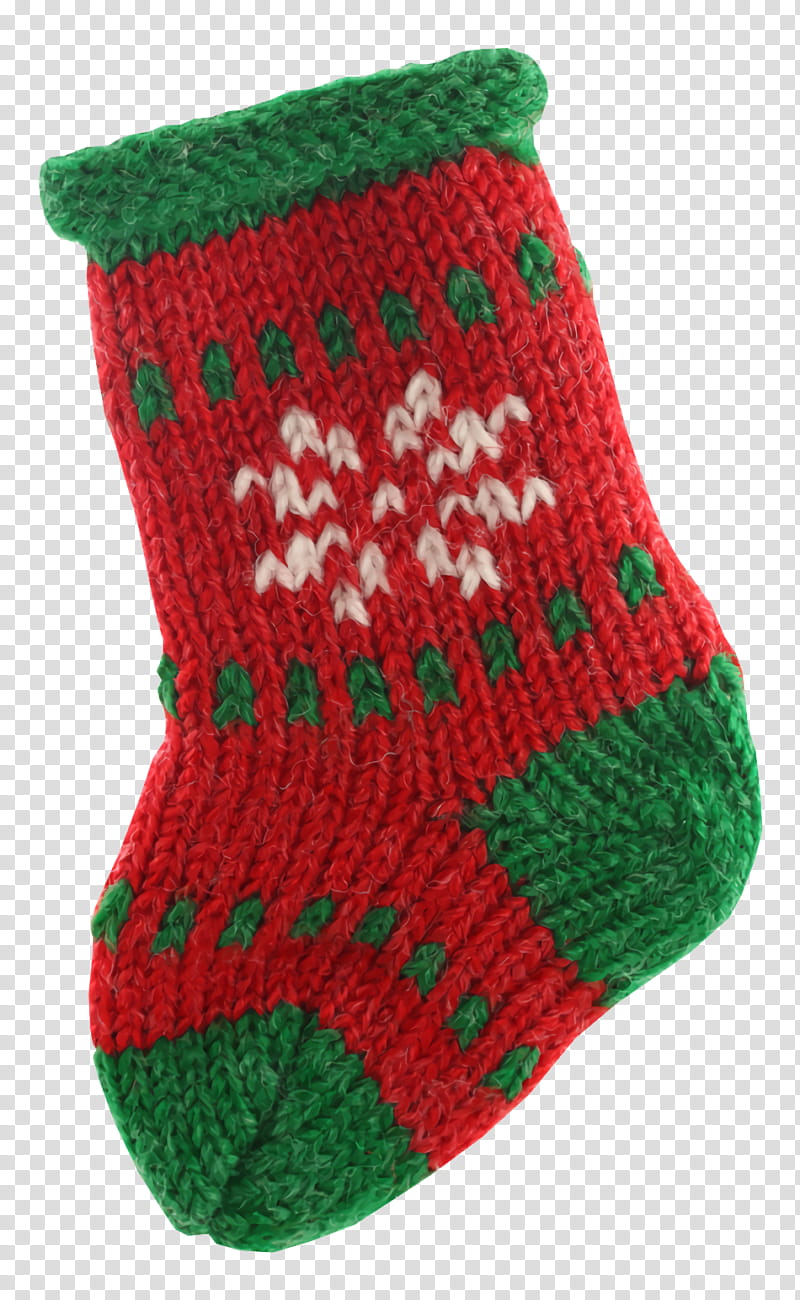 Hand-knitted red and green Christmas stocking with white snowflake and tree motifs on a transparent background.