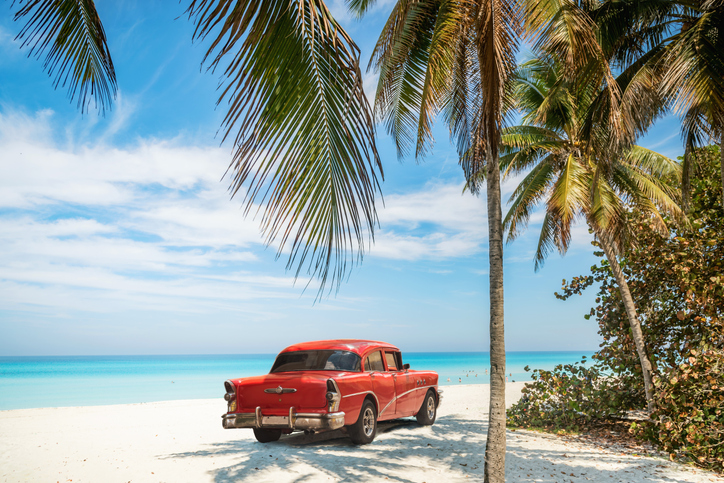 Vintage Red Classic Car on Tropical Beach - Iconic Cuban Scene