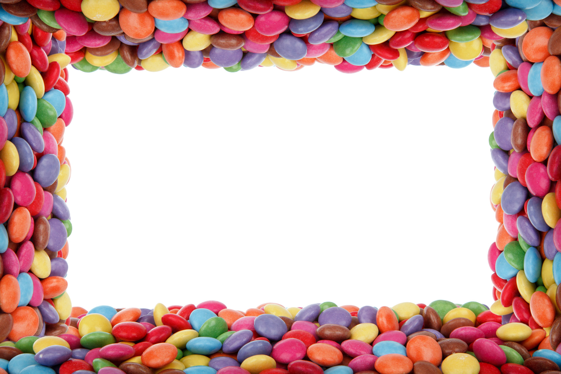 Colorful candy-coated chocolates arranged in a rectangular frame around a white center space.