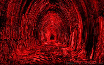 A haunting, deep-red tunnel with arched brick walls receding into darkness, evoking mystery and unease.