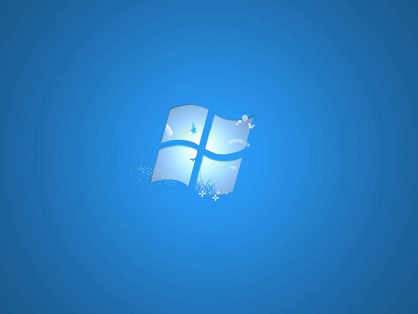 Windows 7 logo with glass-effect panes, grass, snowflakes, and a pine tree on a radial blue background.