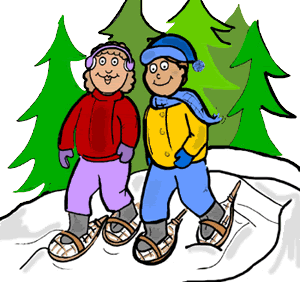Two smiling people wearing winter gear and snowshoes walking in snowy woods with evergreen trees.