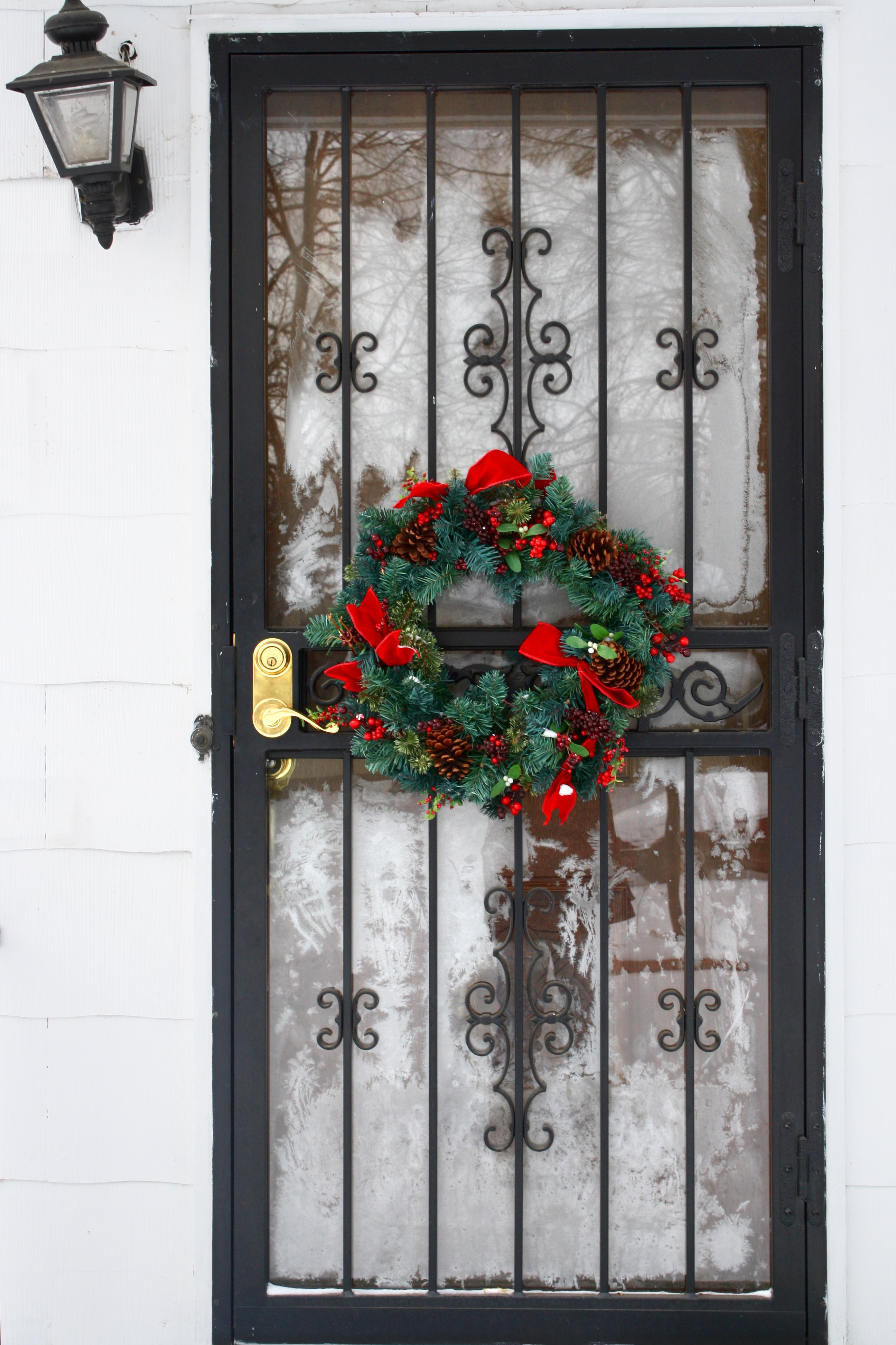 Holiday Wreath on Ornate Screen Door - Classic Winter Decor Inspiration