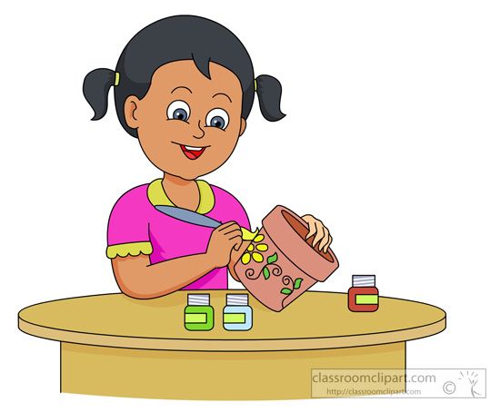 A smiling girl with pigtails paints a clay pot with yellow flowers using a brush and colorful paint bottles on a table.