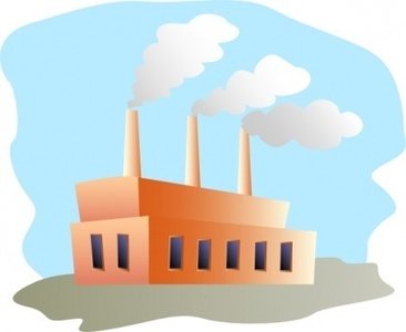 Orange factory with three smokestacks emitting white smoke against a light blue sky.