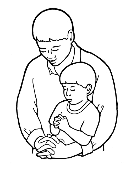 A father gently holds his young son in a comforting embrace, both with eyes closed and hands clasped in prayer or reflection.