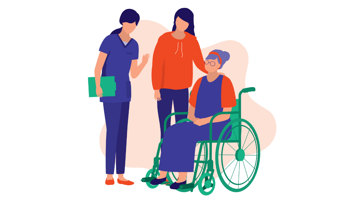 A nurse, caregiver, and elderly woman in a wheelchair interacting warmly in a healthcare setting.