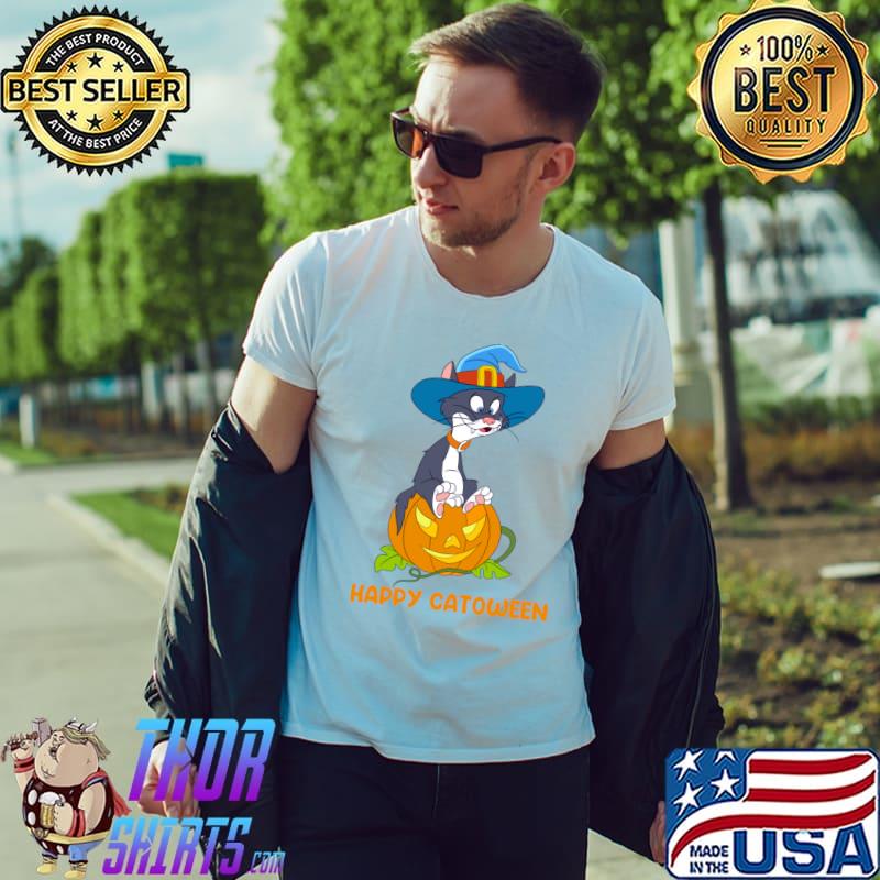 Man wearing white t-shirt with cartoon cat in witch hat inside jack-o'-lantern and "Happy Catoween" text, outdoors.