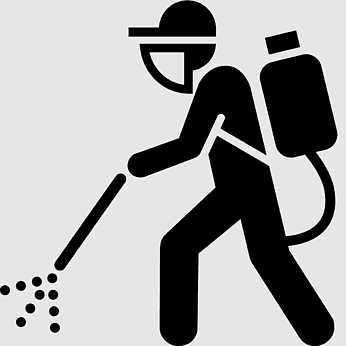Silhouette of a pest control worker spraying with backpack sprayer.