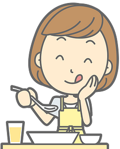 A smiling woman in a yellow apron eating from a bowl with a spoon, enjoying a healthy meal.